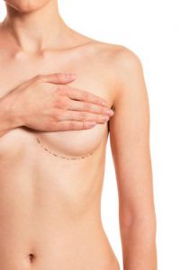 Female Hand Covering Bare Breast with Incision Marking