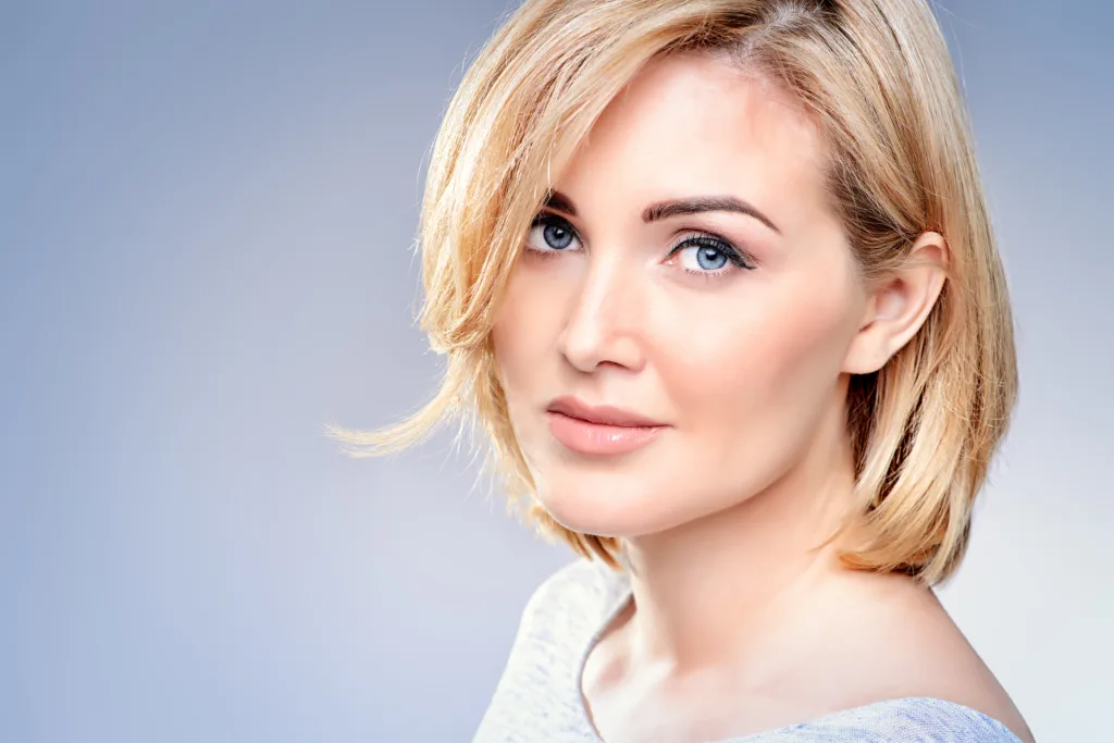 Female with blue eyes and short blond hair | moraitis plastic surgery Female with blue eyes and short blond hair