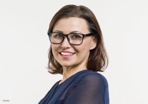 Smiling Mature Woman in Black Glasses