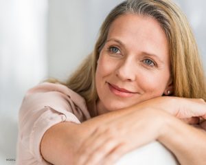 Older Woman with Blue Eyes Resting Head Copy