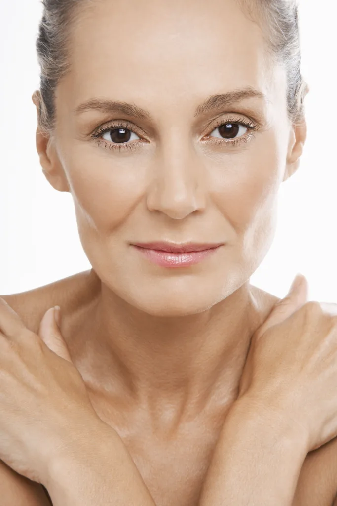 Older woman with hands crossed over bare chest copy | moraitis plastic surgery Older woman with hands crossed over bare chest copy
