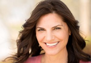 Smiling Mature Brunette with Pink Shirt