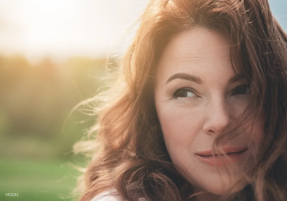 Older woman with sunlight hitting her face