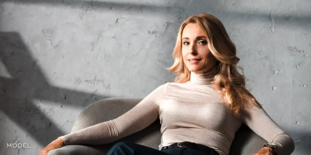 Confident woman after personalized breast augmentation | moraitis plastic surgery Confident woman after personalized breast augmentation